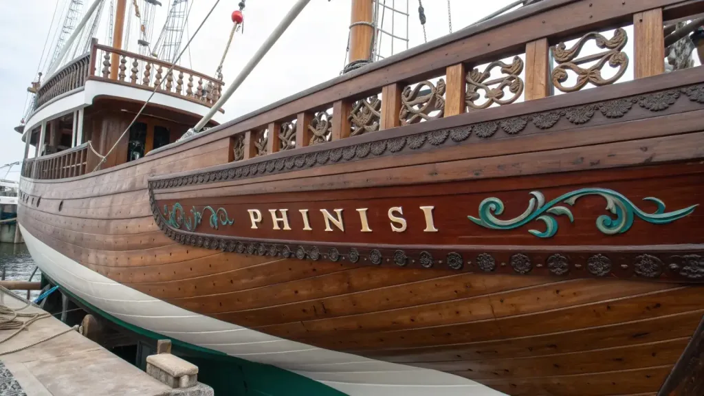 Timber planking and carved detail on the hull of a traditional phinisi